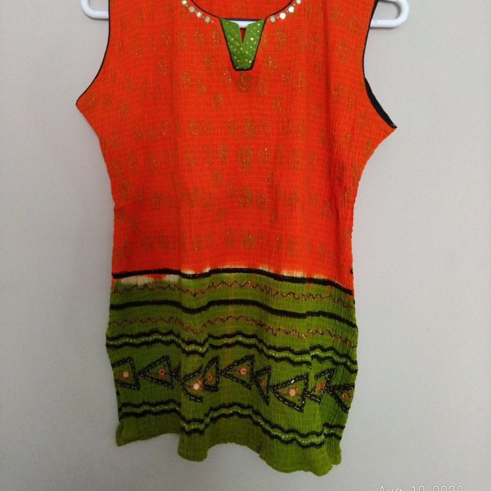 Orange and green women sleeveless top.